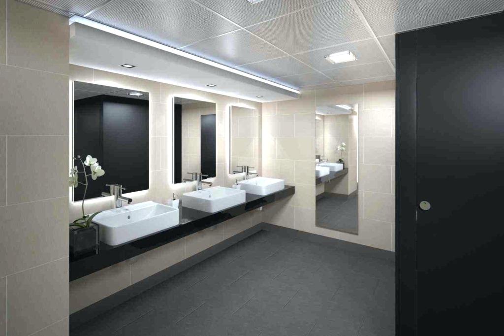 a set of sinks in a modern public washroom
